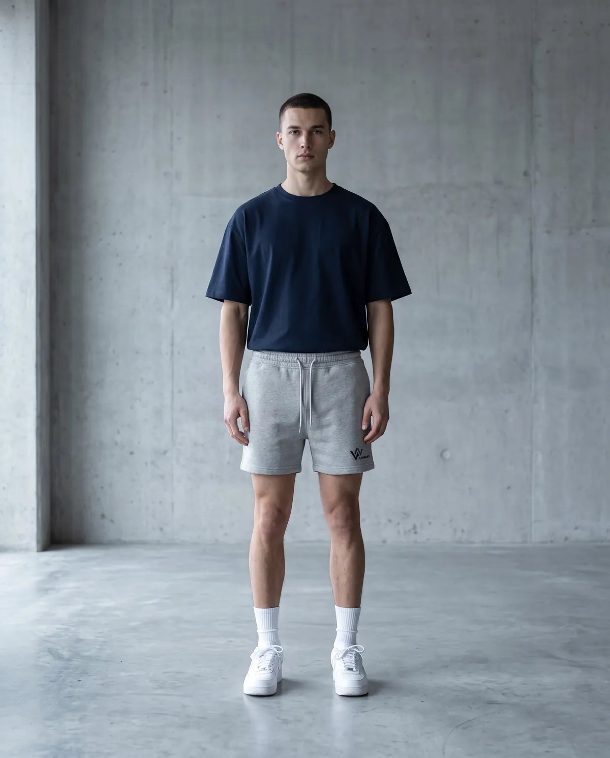 Model in neat heather-grey fleece shorts ending above the knee